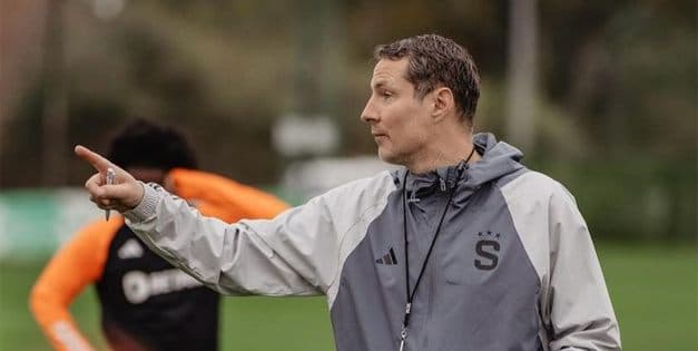 Academy coach directing training