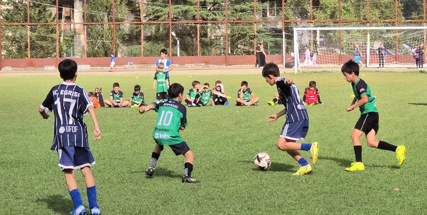 Academy kids chasing the ball