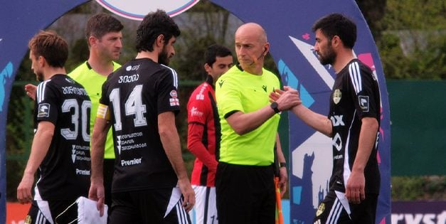 Players shaking hands before kick-off