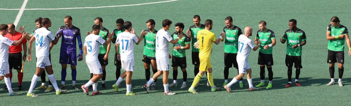 FC Meshakhte players shaking hands before kick-off